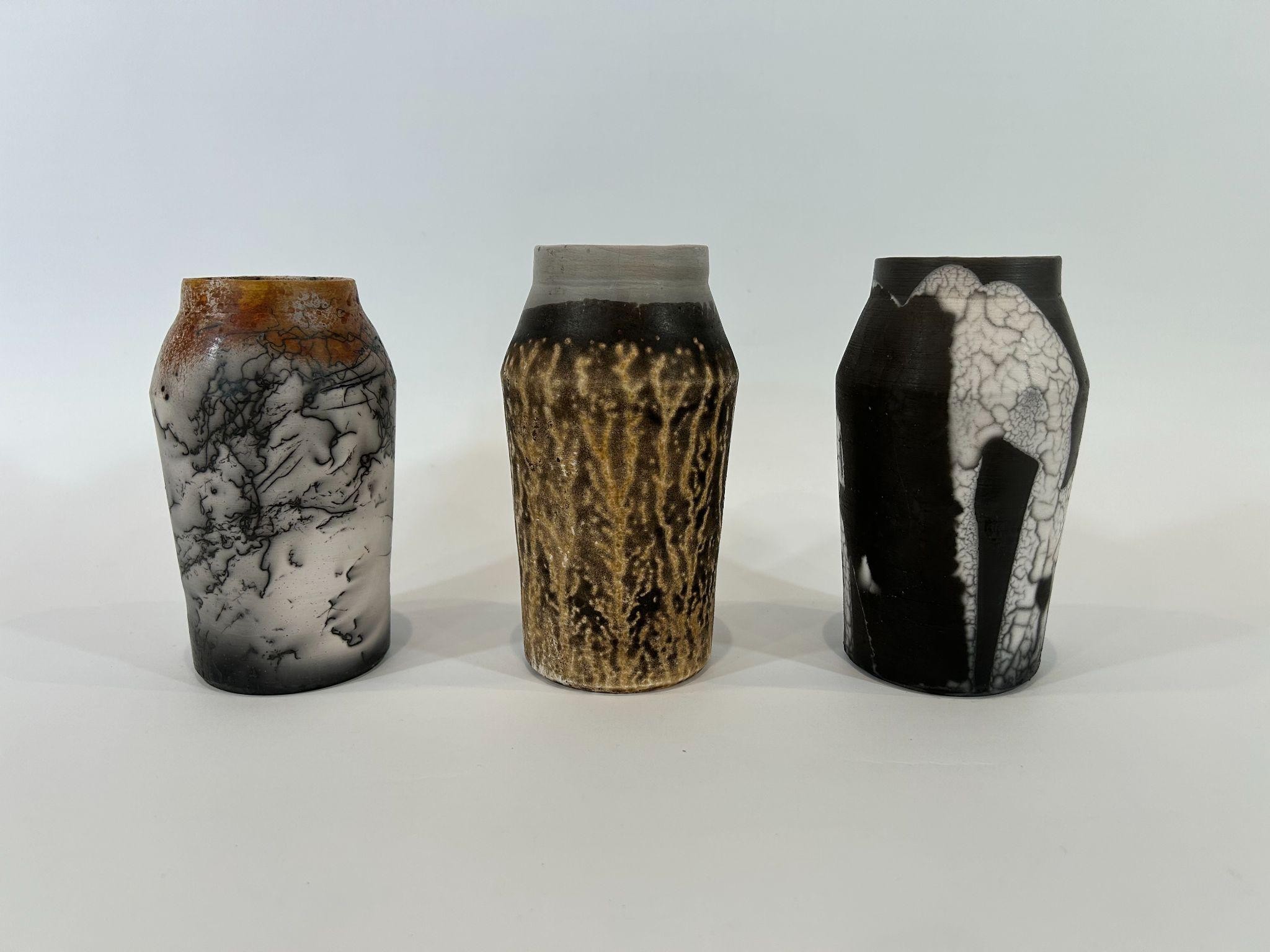 Three raku vessels side by side